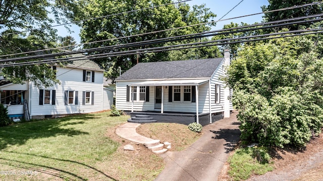 1355 Salem Blvd, Berwick, PA 18603 - view of front of house featuring covered porch, a front yard, a chimney, and a shingled roof