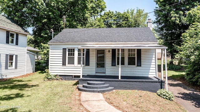 1355 Salem Blvd, Berwick, PA 18603 - bungalow-style home with covered porch, a front lawn, a shingled roof, and a chimney
