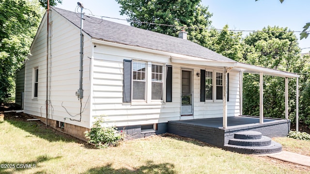 1355 Salem Blvd, Berwick, PA 18603 - view of front of home with a front yard, covered porch, roof with shingles, and a chimney
