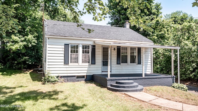 1355 Salem Blvd, Berwick, PA 18603 - bungalow-style house featuring covered porch, a front yard, a shingled roof, and a chimney
