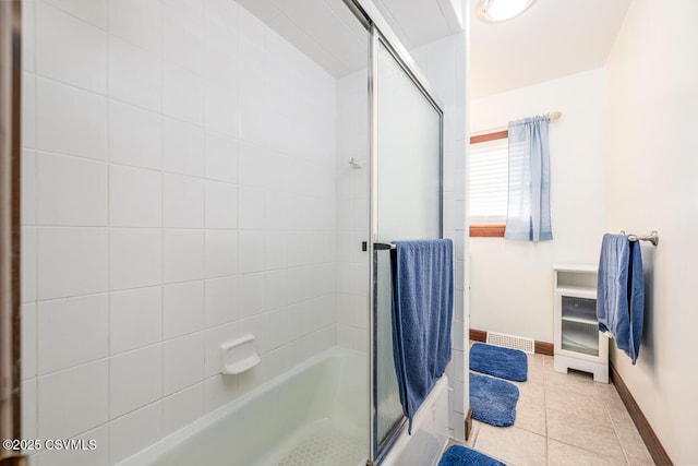 306 Clybourne Ave, Berwick, PA 18603 - bathroom featuring shower / bath combination with glass door, tile patterned flooring, and baseboards