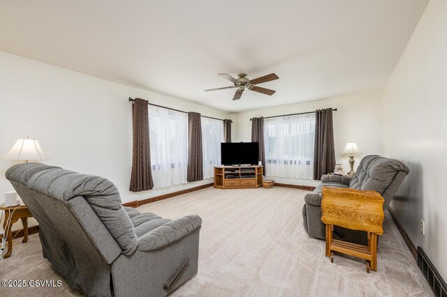 306 Clybourne Ave, Berwick, PA 18603 - living area with plenty of natural light, a ceiling fan, and light carpet