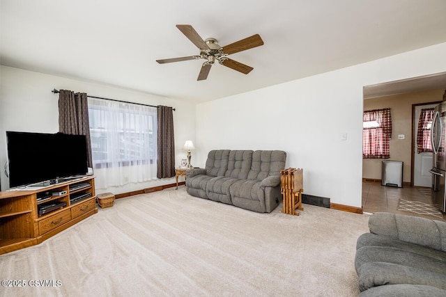 306 Clybourne Ave, Berwick, PA 18603 - carpeted living area featuring a ceiling fan and baseboards