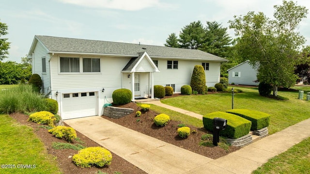 306 Clybourne Ave, Berwick, PA 18603 - bi-level home with an attached garage, driveway, and a front lawn