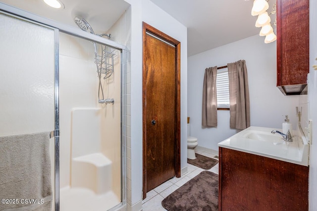 306 Clybourne Ave, Berwick, PA 18603 - bathroom with vanity, a shower stall, toilet, and tile patterned floors
