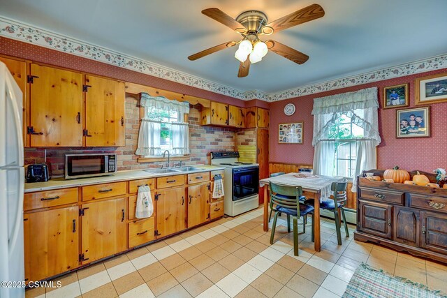 333 Bissets Ln, Bloomsburg, PA 17815 - kitchen featuring white appliances, a sink, light countertops, ceiling fan, and light tile patterned flooring