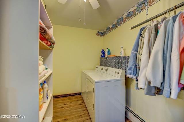 333 Bissets Ln, Bloomsburg, PA 17815 - laundry area with washing machine and clothes dryer, light wood-type flooring, baseboard heating, a ceiling fan, and baseboards