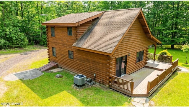 451 Eyersgrove Rd, Bloomsburg, PA 17815 - view of side of home featuring log exterior, a shingled roof, a lawn, and a deck