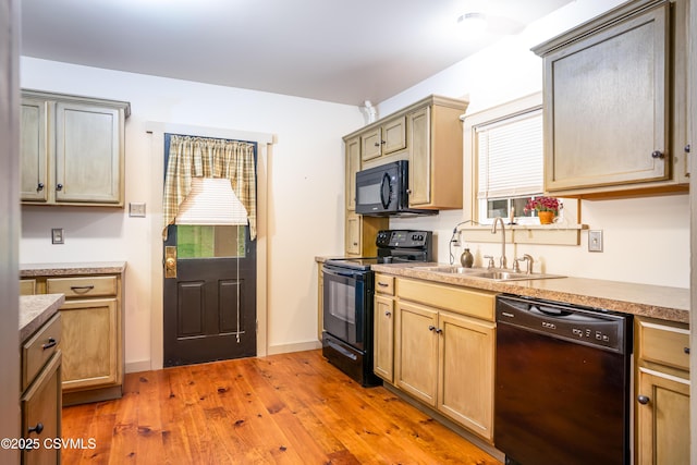 637 Pfahler St, Catawissa, PA 17820 - kitchen featuring black appliances, light wood-type flooring, light countertops, and light brown cabinetry
