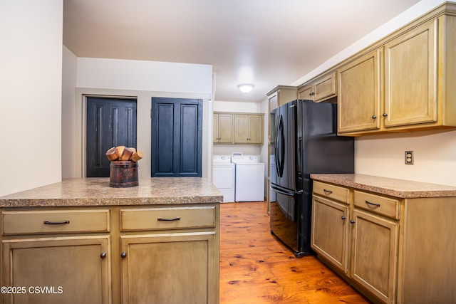 637 Pfahler St, Catawissa, PA 17820 - kitchen with washing machine and clothes dryer, light wood-type flooring, freestanding refrigerator, and light countertops