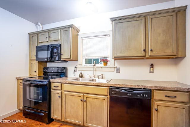 637 Pfahler St, Catawissa, PA 17820 - kitchen featuring black appliances, light wood-type flooring, light countertops, and light brown cabinetry