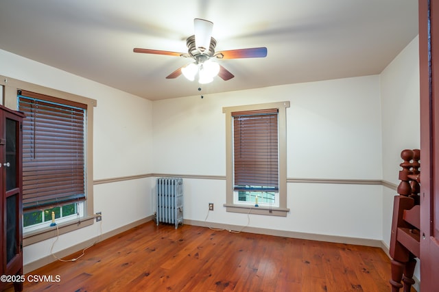 637 Pfahler St, Catawissa, PA 17820 - spare room with radiator heating unit, ceiling fan, and hardwood / wood-style flooring