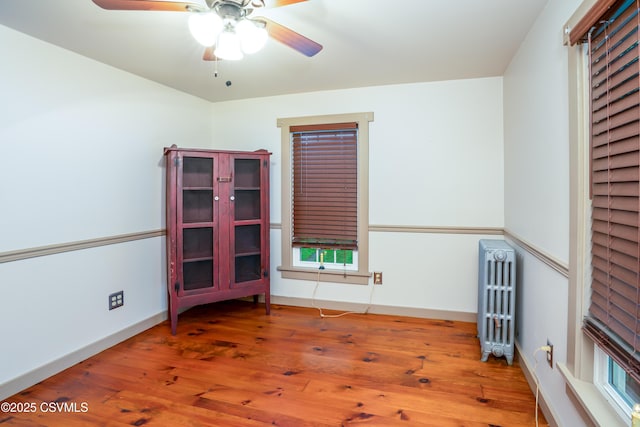 637 Pfahler St, Catawissa, PA 17820 - unfurnished room featuring radiator heating unit, a ceiling fan, and wood finished floors