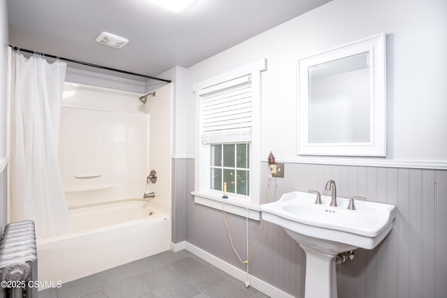 637 Pfahler St, Catawissa, PA 17820 - full bathroom featuring shower / bathtub combination with curtain, radiator, a wainscoted wall, and tile patterned flooring