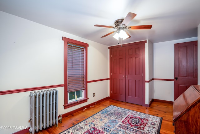 637 Pfahler St, Catawissa, PA 17820 - unfurnished bedroom featuring radiator, wood finished floors, ceiling fan, and a closet