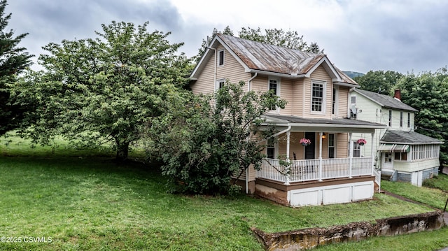 637 Pfahler St, Catawissa, PA 17820 - view of front facade featuring covered porch and a front lawn