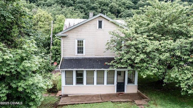 637 Pfahler St, Catawissa, PA 17820 - back of house featuring a sunroom and a forest view
