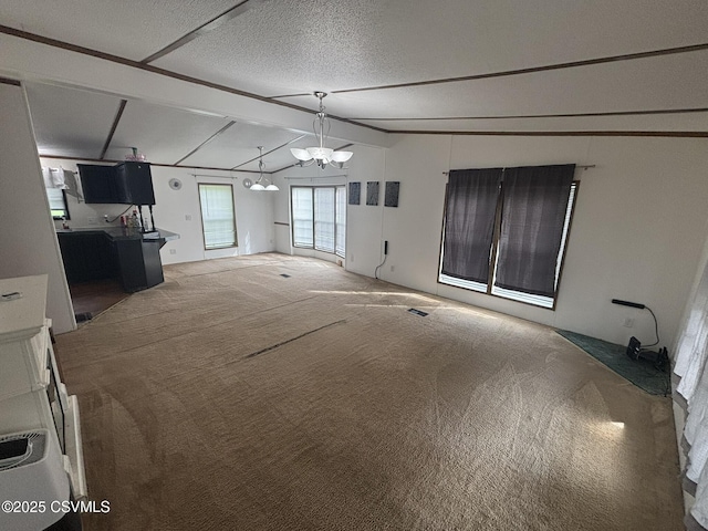 1311 Water St, Northumberland, PA 17857 - unfurnished living room featuring carpet floors, a chandelier, and a textured ceiling