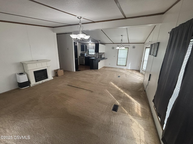 1311 Water St, Northumberland, PA 17857 - unfurnished living room with light colored carpet, a chandelier, a glass covered fireplace, and crown molding