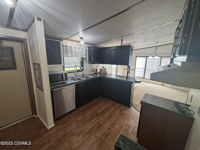 1311 Water St, Northumberland, PA 17857 - kitchen featuring appliances with stainless steel finishes, dark countertops, a textured ceiling, dark wood-style floors, and plenty of natural light