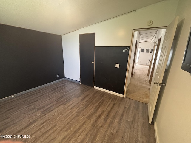 1311 Water St, Northumberland, PA 17857 - unfurnished bedroom featuring lofted ceiling and dark wood-style flooring