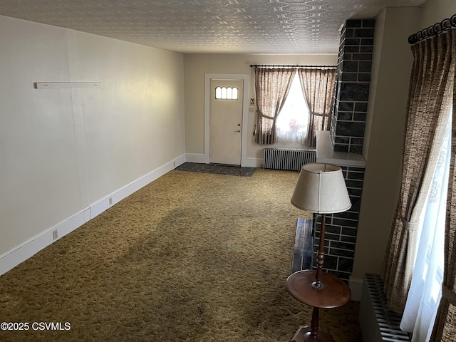1409 Scott St, Kulpmont, PA 17834 - carpeted entryway with radiator and baseboards