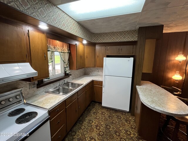 1409 Scott St, Kulpmont, PA 17834 - kitchen with white appliances, a sink, light countertops, exhaust hood, and dark floors