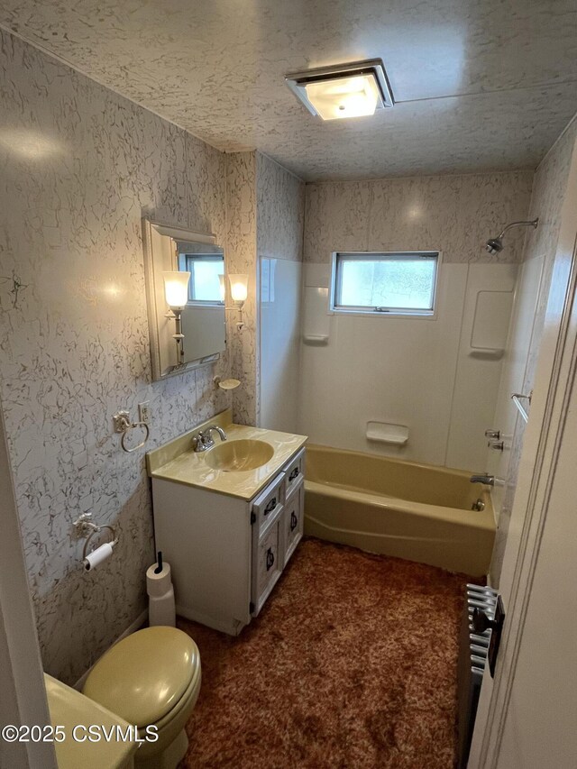 1409 Scott St, Kulpmont, PA 17834 - full bathroom featuring vanity, shower / bath combination, toilet, and a textured ceiling