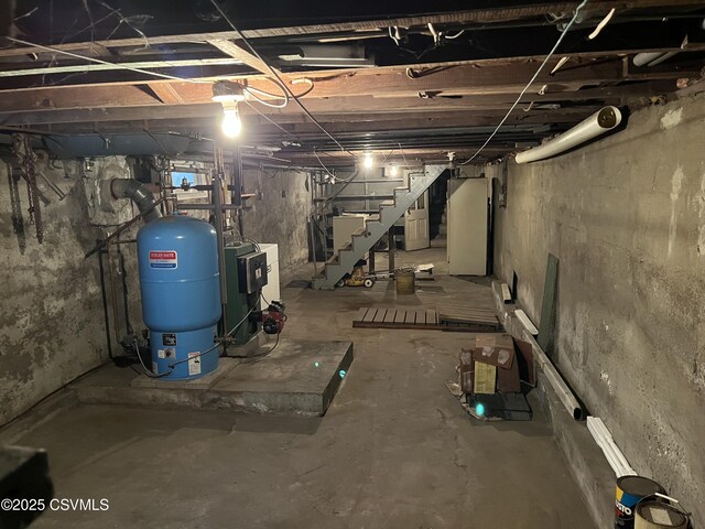 1409 Scott St, Kulpmont, PA 17834 - unfinished below grade area with a water pressure tank and stairs