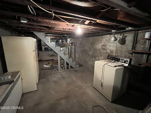 1409 Scott St, Kulpmont, PA 17834 - unfinished below grade area featuring freestanding refrigerator, washer / clothes dryer, and stairs