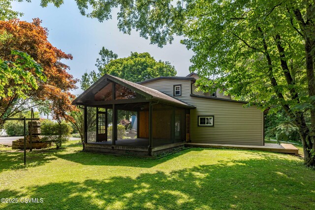 110 W 8th St, Watsontown, PA 17777 - rear view of property featuring a lawn, a gazebo, and a sunroom