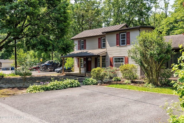 110 W 8th St, Watsontown, PA 17777 - view of front facade featuring a porch, a standing seam roof, and a metal roof