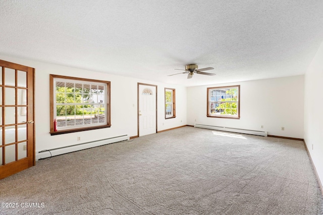110 W 8th St, Watsontown, PA 17777 - carpeted spare room with baseboard heating, a baseboard heating unit, ceiling fan, and a textured ceiling