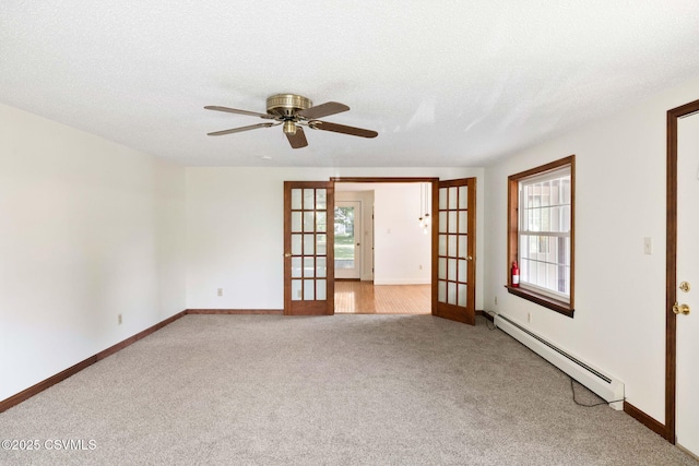 110 W 8th St, Watsontown, PA 17777 - spare room with baseboard heating, french doors, carpet floors, and ceiling fan