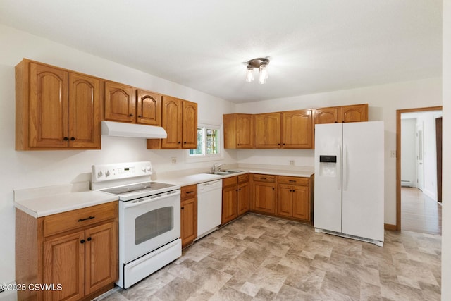 110 W 8th St, Watsontown, PA 17777 - kitchen featuring white appliances, under cabinet range hood, brown cabinets, and light countertops