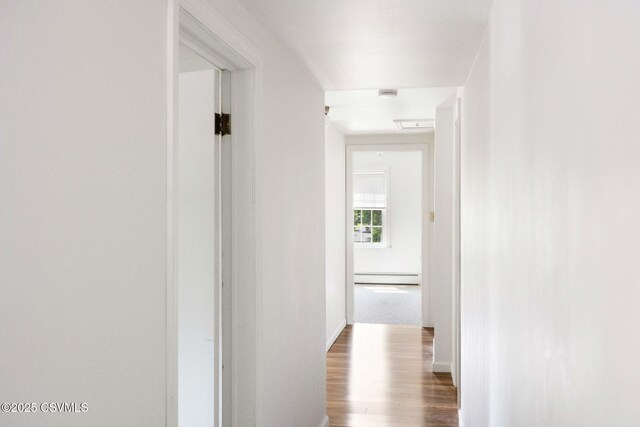 110 W 8th St, Watsontown, PA 17777 - hall featuring baseboard heating and wood finished floors