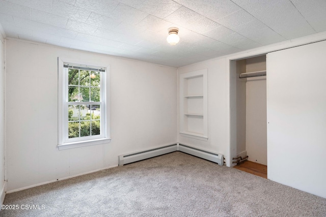 110 W 8th St, Watsontown, PA 17777 - unfurnished bedroom with carpet, a closet, and a baseboard heating unit