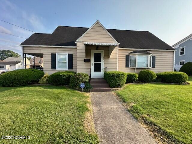 1030 Orange St, Berwick, PA 18603 - bungalow-style home featuring a front lawn