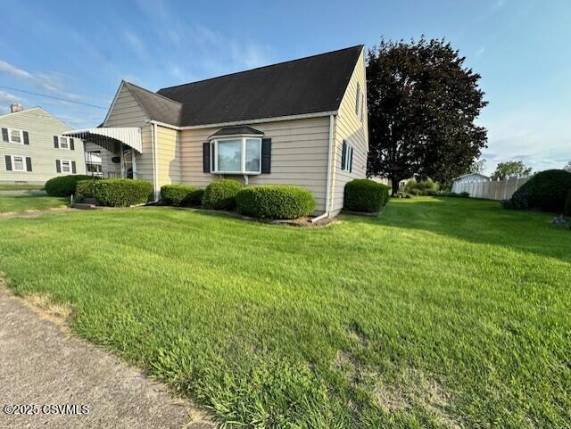 1030 Orange St, Berwick, PA 18603 - view of side of home featuring a yard