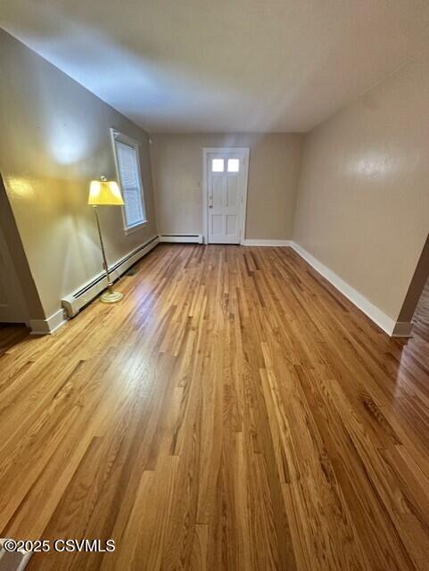 1030 Orange St, Berwick, PA 18603 - unfurnished room featuring wood finished floors and baseboard heating