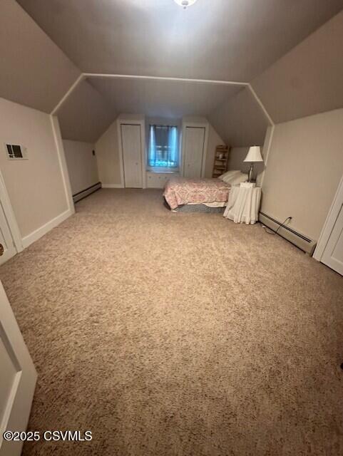 1030 Orange St, Berwick, PA 18603 - unfurnished bedroom with baseboard heating, light carpet, and lofted ceiling
