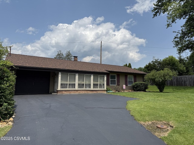 128 Woodside Rd, Sunbury, PA 17801 - ranch-style house with an attached garage, driveway, and a chimney