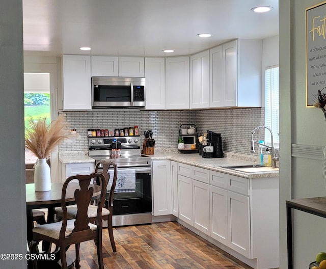 124 E Coal St, Trevorton, PA 17881 - kitchen featuring appliances with stainless steel finishes, white cabinets, backsplash, and recessed lighting