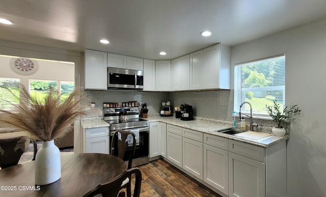 124 E Coal St, Trevorton, PA 17881 - kitchen featuring appliances with stainless steel finishes, dark wood finished floors, tasteful backsplash, white cabinets, and recessed lighting