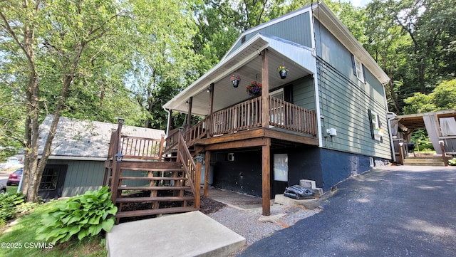 124 E Coal St, Trevorton, PA 17881 - rear view of property with stairway, a garage, and a wooden deck
