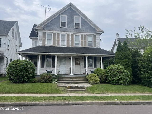612-614 1st St, Nescopeck, PA 18635 - victorian home featuring covered porch and a front yard