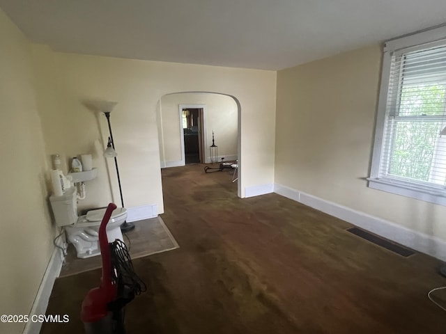 612-614 1st St, Nescopeck, PA 18635 - unfurnished room with arched walkways and dark colored carpet