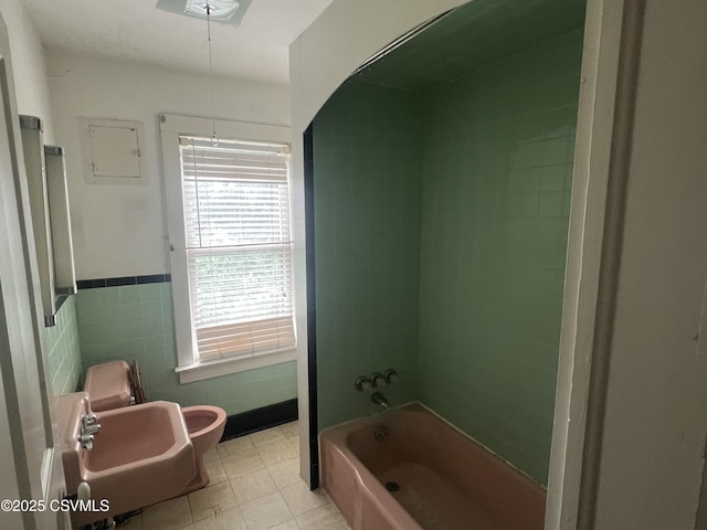 612-614 1st St, Nescopeck, PA 18635 - full bathroom featuring tile walls, shower / tub combination, and wainscoting