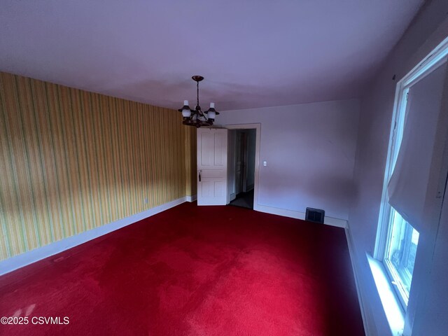 612-614 1st St, Nescopeck, PA 18635 - spare room featuring a chandelier and carpet flooring