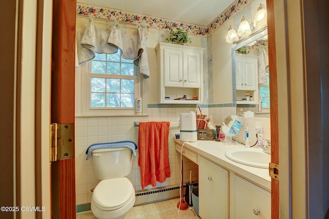 7 N Red Maple St, Selinsgrove, PA 17870 - half bath with a baseboard heating unit, tile walls, and vanity